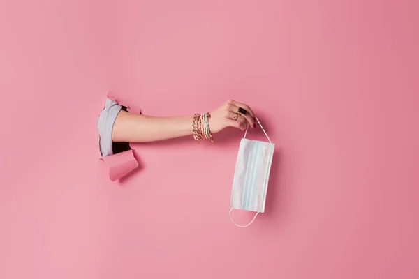 Cropped View Woman Holding Medical Mask Pink Background Hole — Stock Photo, Image