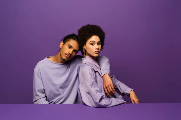 Young Model Hugging Curly African American Woman Isolated Purple — Stock Photo, Image