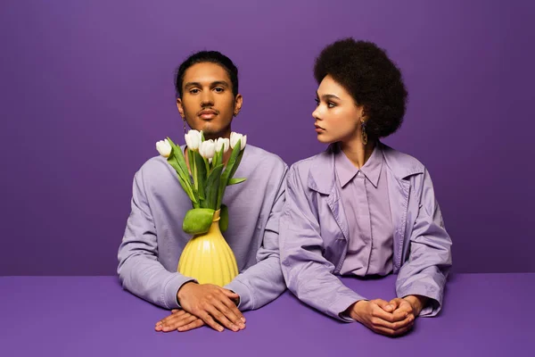 Young African American Couple Sitting Vase Tulips Isolated Purple — Stock Photo, Image