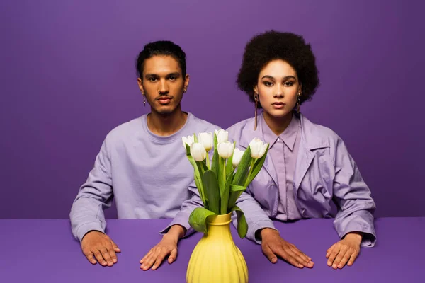 African American Couple Sitting Vase White Tulips Isolated Purple — Stock Photo, Image
