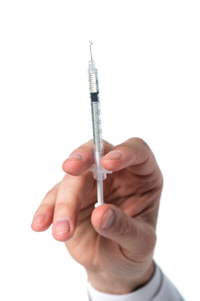 Cropped view of syringe in hand of doctor isolated on white 