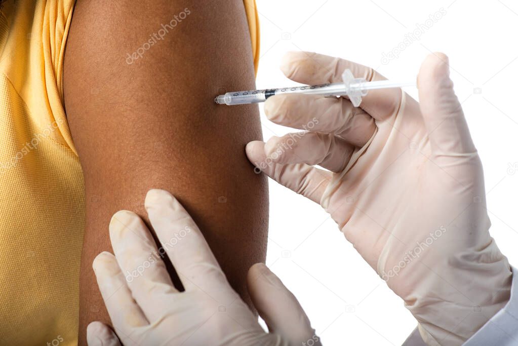 Cropped view of doctor in latex gloves doing vaccination of african american man isolated on white 