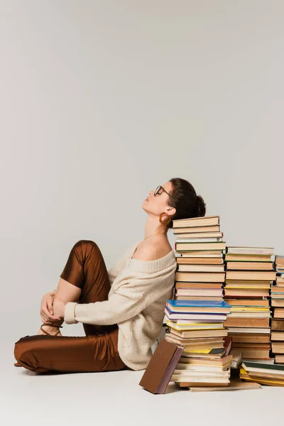 Side View Young Woman Glasses Sweater Leaning Stack Books White — Stock Photo, Image