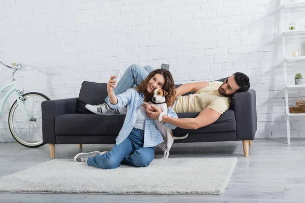 Happy Young Woman Taking Selfie Jack Russell Terrier Muslim Boyfriend — Stock Photo, Image