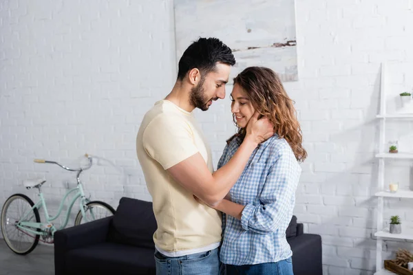 Smiling Multiethnic Man Woman Hugging Home — Stock Photo, Image