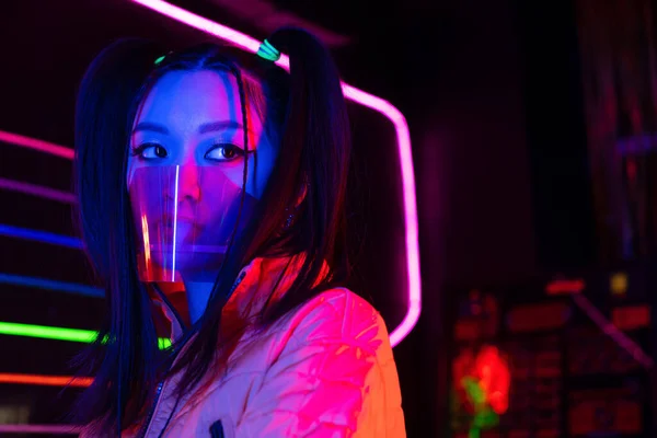 Young Asian Woman Face Shield Neon Lighting — Foto de Stock