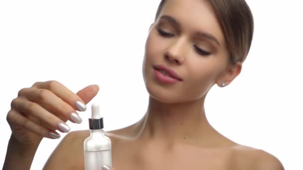 Young Woman Holding Bottle Pipette Serum Isolated White — Stock Video