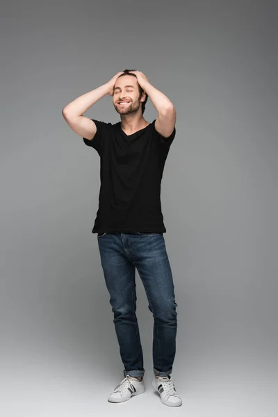 Full Length Happy Man Jeans Black Shirt Posing Grey — Stock Photo, Image