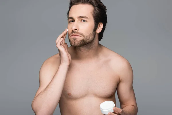 Shirtless Man Applying Moisturizing Face Cream Isolated Grey — Stock Photo, Image