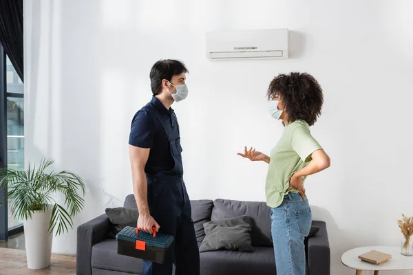 African American Woman Medical Mask Gesturing Handyman Toolbox — Stock Photo, Image