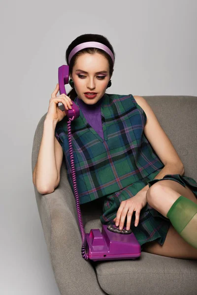 Brunette Young Woman Talking Purple Retro Phone While Sitting Armchair — Stock Photo, Image