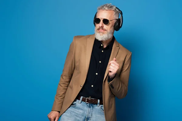 Cheerful Middle Aged Man Sunglasses Listening Music Headphones Dancing Blue — Stock Photo, Image