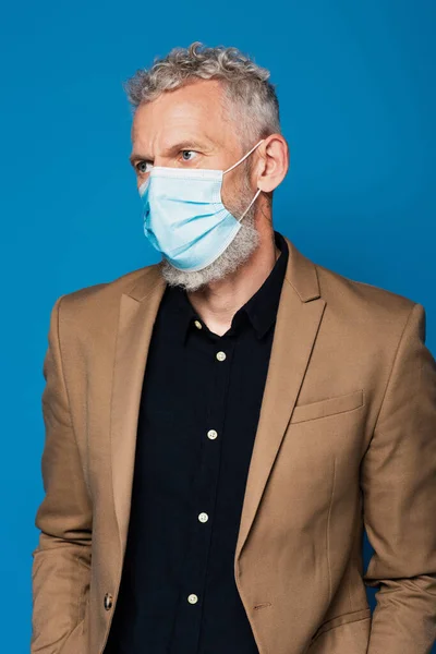Middle Aged Man Medical Mask Looking Away Isolated Blue — Stock Photo, Image