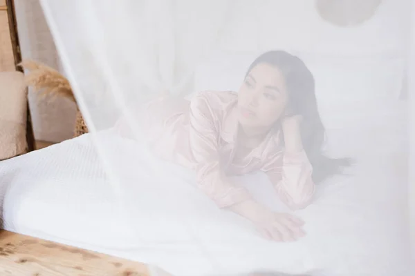 Young Asian Woman Silk Pajamas Lying Curtain White Linen Hand — Stock Photo, Image