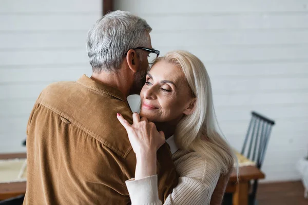 Smiling Woman Embracing Husband Eyeglasses — Stockfoto