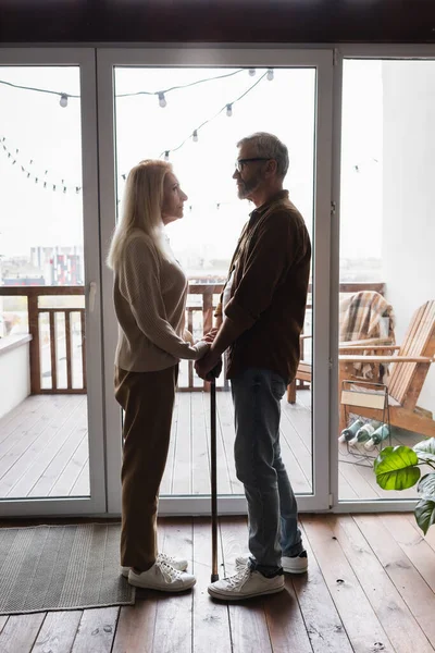 Side View Senior Woman Holding Hands Husband Crutch — Stock Photo, Image
