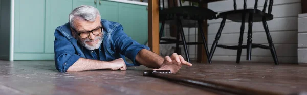 Surface Level Senior Man Lying Floor Crutch Banner — Stok fotoğraf