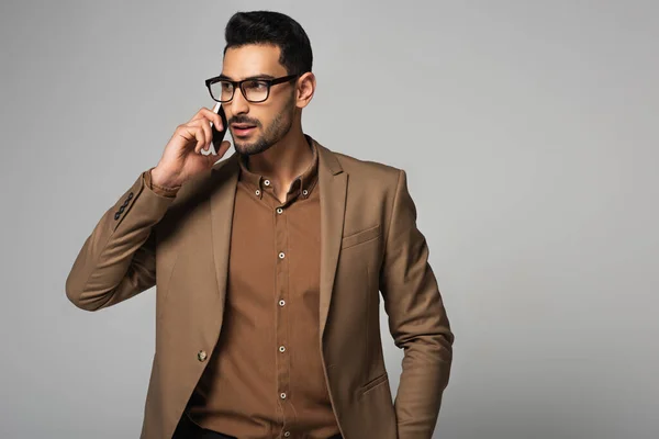 Good Looking Muslim Businessman Talking Mobile Phone Isolated Grey — Zdjęcie stockowe