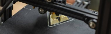 close up view of 3D printer creating plastic model on blurred background, banner clipart