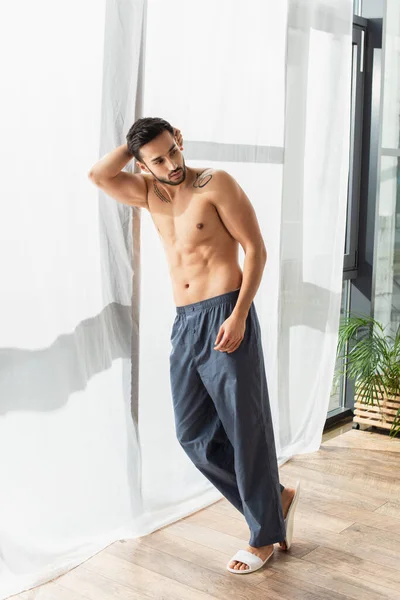 Shirtless Man Slippers Pants Standing Window — Stock Photo, Image
