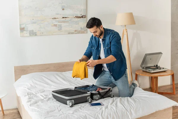 Young Tourist Putting Clothes Suitcase Air Ticket Passport Bed — Stock Photo, Image