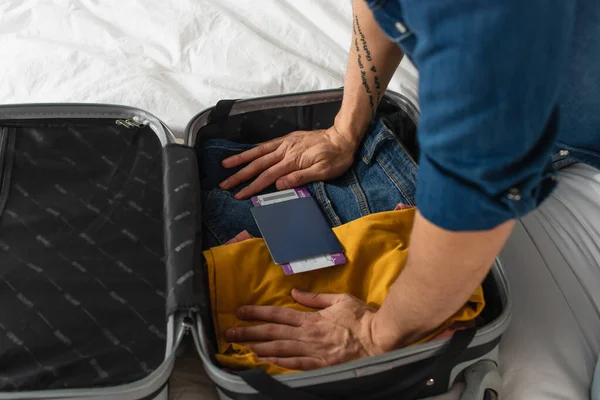 Cropped View Passport Boarding Pass Tourist Pressing Clothes Suitcase Bed — Stock Photo, Image