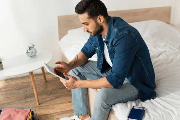 Side View Young Man Using Digital Tablet Passport Suitcase Home — Stock Photo, Image