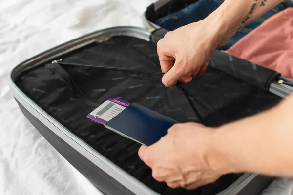 Cropped View Tourist Holding Passport Boarding Pass Suitcase Bed — Stock Photo, Image