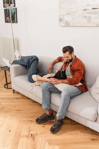 Smiling Man Holding Hand Girlfriend Couch Home — Stock Photo, Image