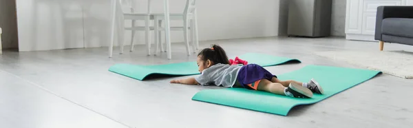 Toddler Asian Girl Sportswear Lying Fitness Mat Home Banner — Stock Photo, Image