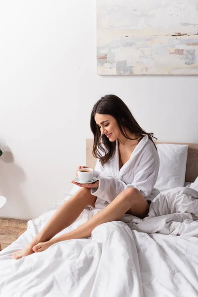 Joyful Young Woman Holding Cup Coffee Saucer Bedroom — Stock Photo, Image