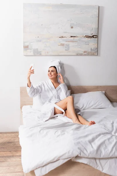 Happy Woman Towel Head Bathrobe Taking Selfie Bedroom — Stock Photo, Image