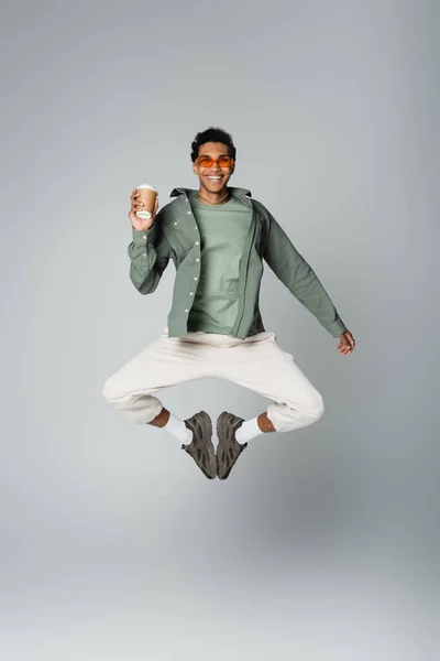 Excited African American Man Trendy Clothes Jumping Paper Cup Isolated — Stock Photo, Image