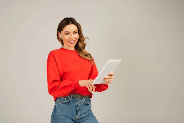 Happy Woman Wireless Earphones Holding Digital Tablet Isolated Grey — Stock Photo, Image