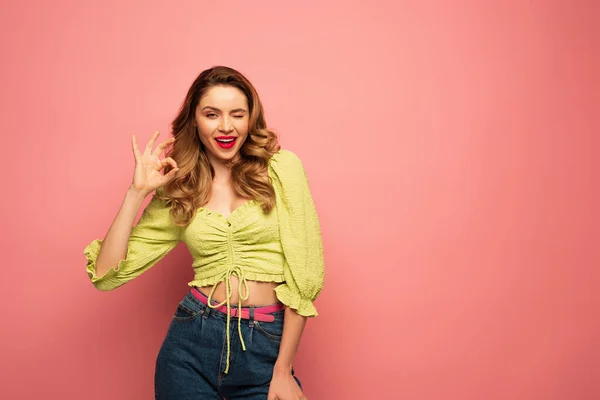 Cheerful Woman Green Blouse Showing Sign While Winking Eye Isolated — Stock Photo, Image