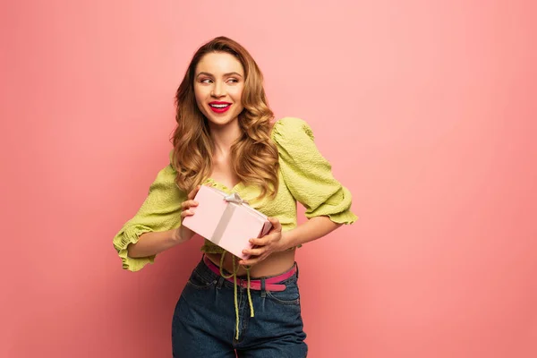 Cheerful Woman Holding Wrapped Present Isolated Pink — Stock Photo, Image