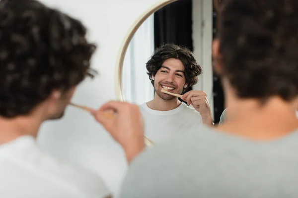 Happy Gay Couple Brushing Teeth Looking Mirror Bathroom — Stock Photo, Image