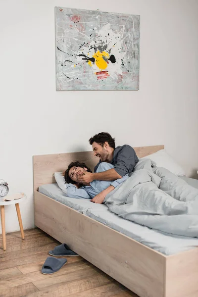 Happy Gay Man Touching Chin Boyfriend Bed — Stock Photo, Image