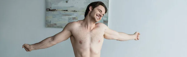 Cheerful Shirtless Man Stretching Closed Eyes Bedroom Banner — Stock Photo, Image