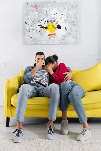 African American Woman Hiding Scared Boyfriend Remote Controller — Stock Photo, Image