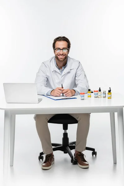 Happy Physician Sitting Desk Laptop Containers Medical Cannabis White — Stock Photo, Image