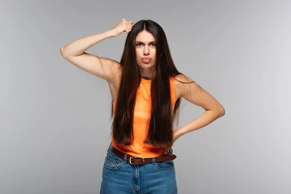 Angry Woman Standing Hand Hip Knocking Head Isolated Grey — Stock Photo, Image