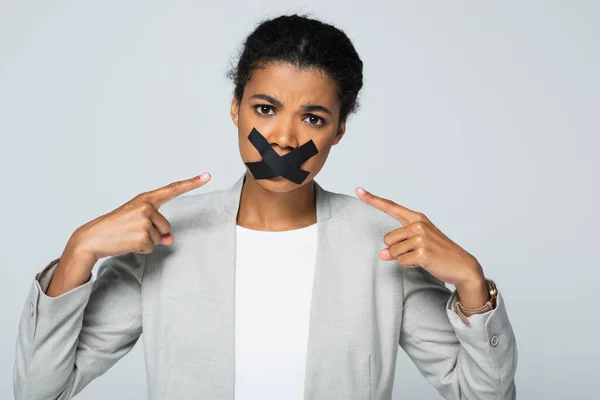 African American Businesswoman Pointing Scotch Tape Mouth Isolated Grey — Stock Photo, Image