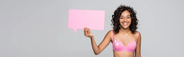 Smiling African American Woman Rink Ribbon Bra Holding Speech Bubble — Stock Photo, Image