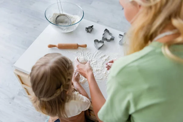 Overhead View Blurred Woman Showing Dough Daughter Kitchen — Stock Photo, Image