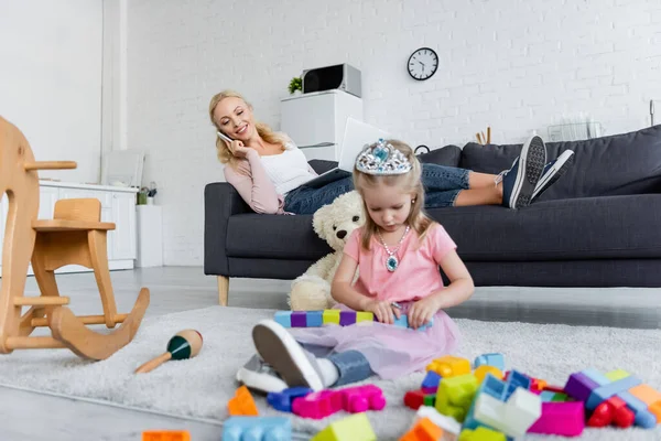 Smiling Woman Talking Smartphone Daughter Toy Crown Playing Floor — Stock Photo, Image