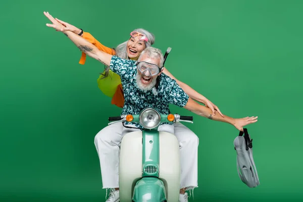 Multiethnic Cheerful Middle Aged Couple Outstretched Hands Riding Moped Green — Stock Photo, Image