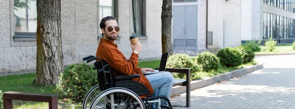 Disabled Man Sunglasses Holding Coffee While Sitting Wheelchair Laptop Banner — Stock Photo, Image