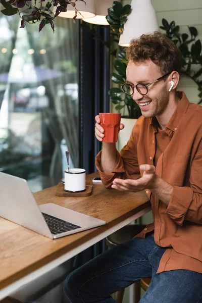 Happy Young Man Glasses Gesturing Video Call Cafe — Stock Photo, Image