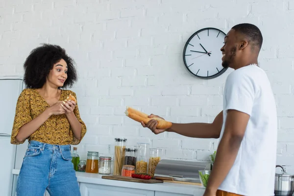 African American Man Holding Baguette Girlfriend Kitchen — Stock Photo, Image